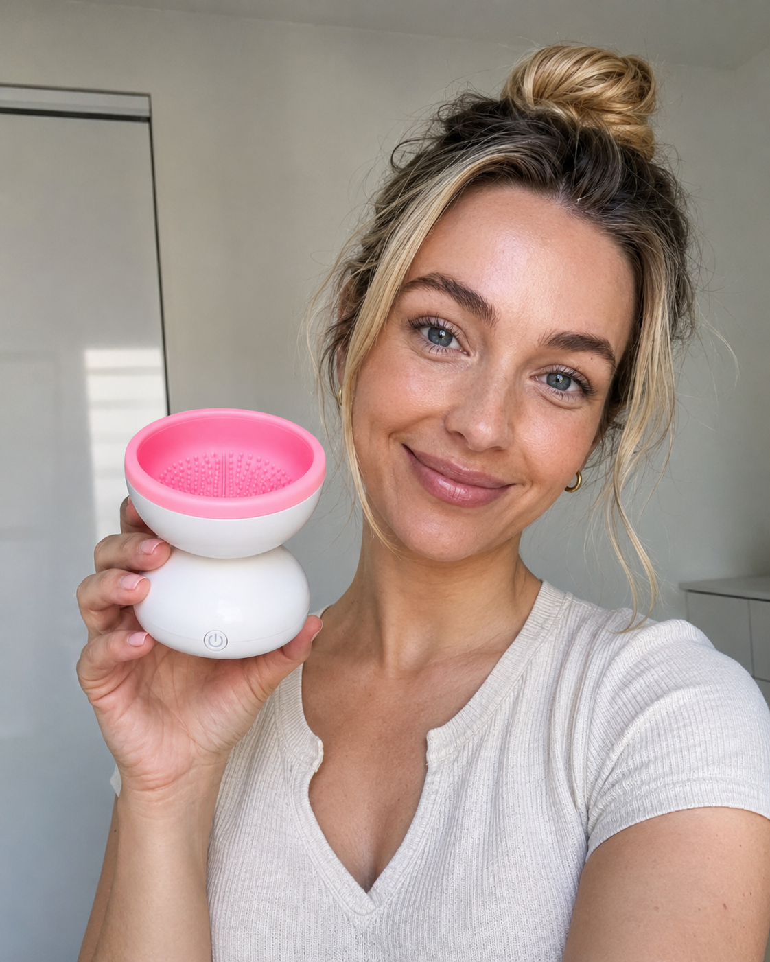 Electric Makeup Brush Cleaner next to makeup brushes and products