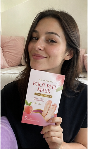 Customer relaxing while wearing the Foot Peel Mask