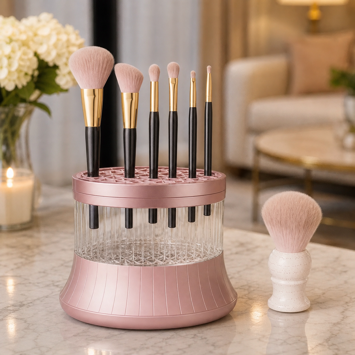 Electric Makeup Brush Cleaner in Pink on a marble vanity surface